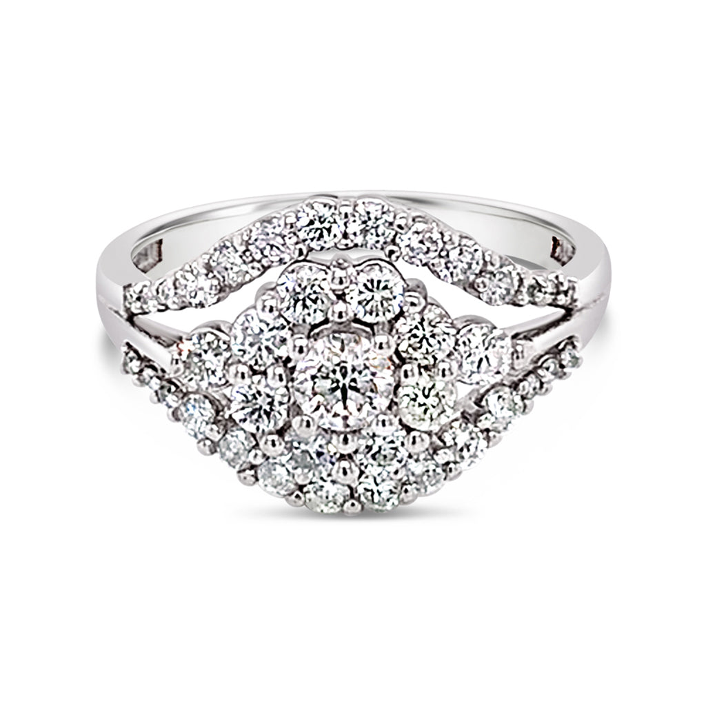 14K White Gold Ring With A 0.19 CT Center Canadian Diamond And Additional Diamonds Surrounding